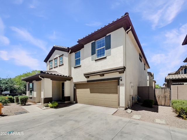 mediterranean / spanish house featuring a garage