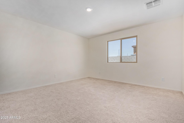 empty room with light colored carpet