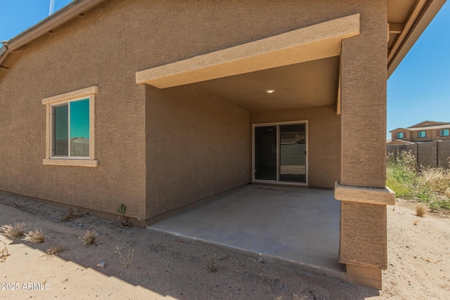 rear view of house featuring a patio