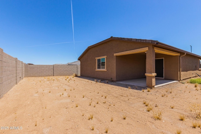 rear view of house featuring a patio