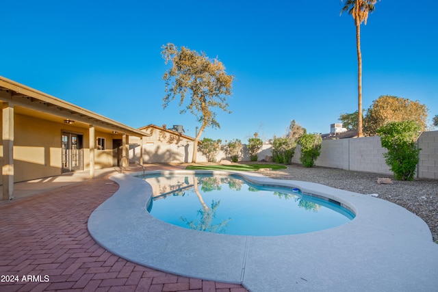 view of swimming pool with a patio