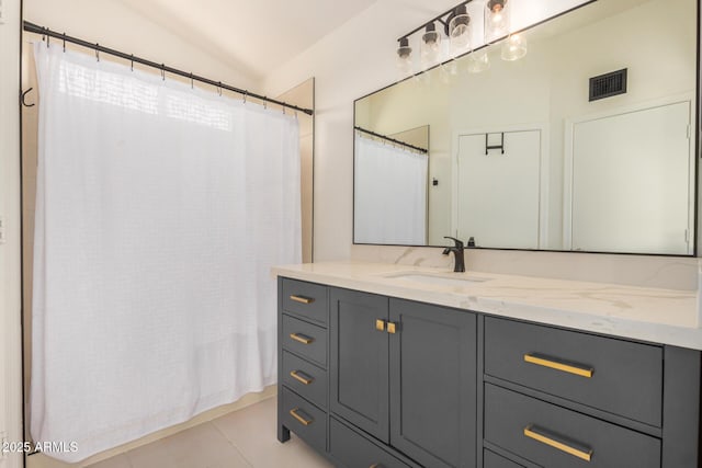 11531 E Persimmon Ave, Mesa, AZ 85212 - full bath with vaulted ceiling, vanity, tile patterned floors, and a shower with curtain