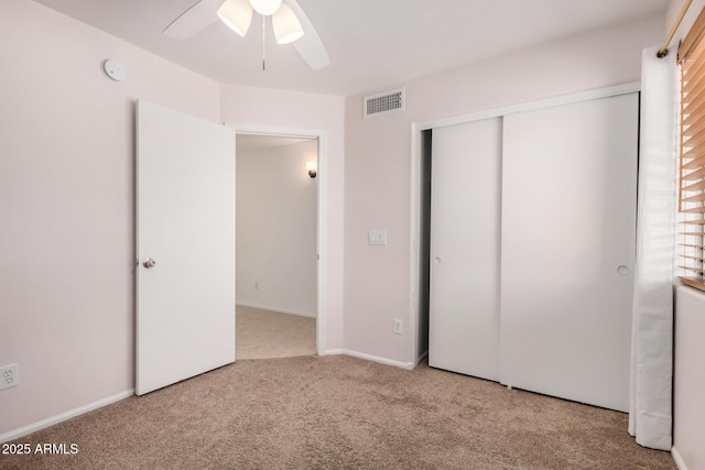 11531 E Persimmon Ave, Mesa, AZ 85212 - unfurnished bedroom with carpet floors, a closet, and a ceiling fan