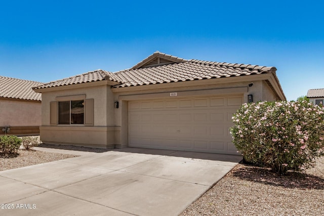 11531 E Persimmon Ave, Mesa, AZ 85212 - view of front of home with an attached garage, a tiled roof, stucco siding, and driveway
