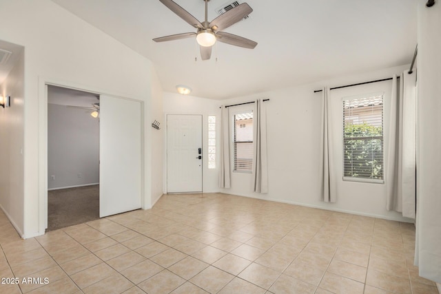 11531 E Persimmon Ave, Mesa, AZ 85212 - spare room featuring ceiling fan, lofted ceiling, light tile patterned flooring, attic access, and baseboards
