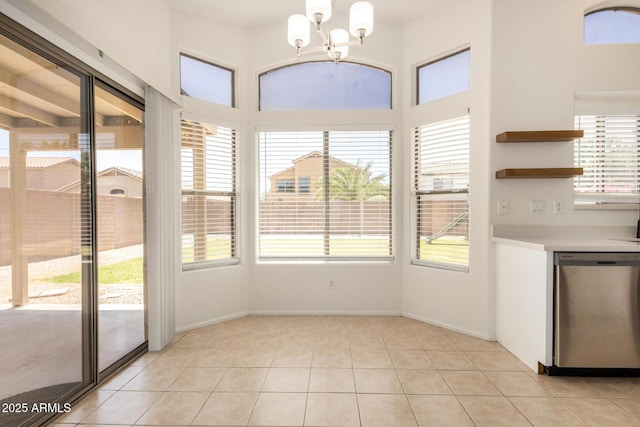 11531 E Persimmon Ave, Mesa, AZ 85212 - unfurnished dining area featuring healthy amount of natural light, a chandelier, and light tile patterned floors