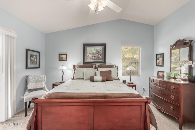 carpeted bedroom with lofted ceiling and ceiling fan