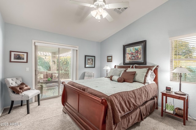 carpeted bedroom with multiple windows, lofted ceiling, access to exterior, and ceiling fan