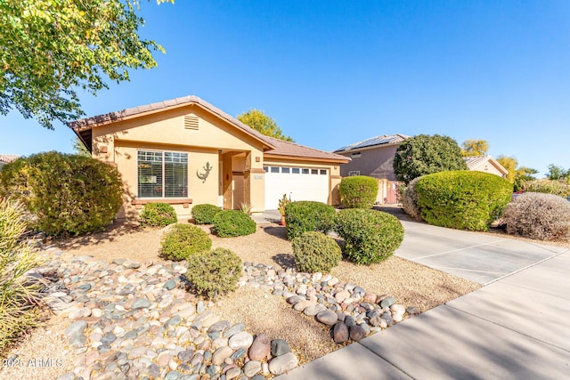 ranch-style home featuring a garage