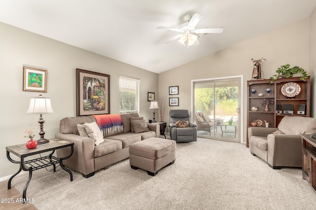 carpeted living room featuring lofted ceiling, a wealth of natural light, and ceiling fan