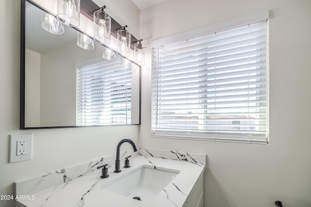 bathroom with vanity and a healthy amount of sunlight