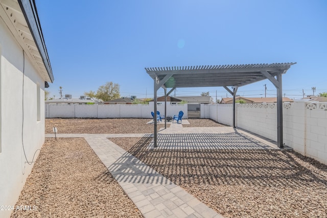 view of yard with a pergola and a patio area