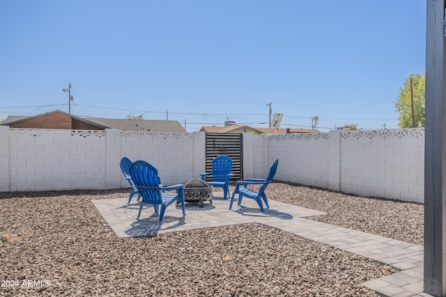 view of patio / terrace featuring a fire pit