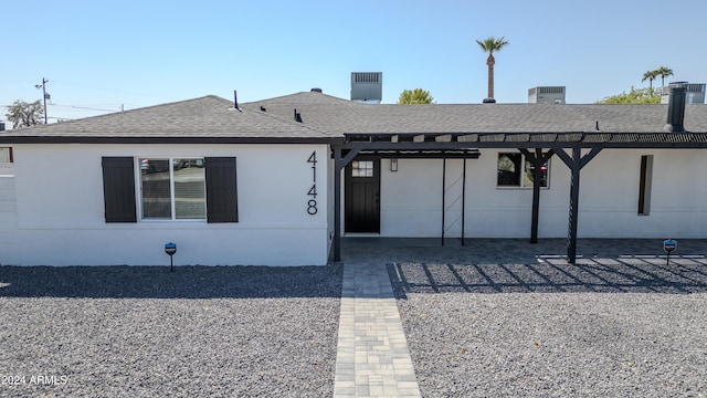 ranch-style house with central AC unit