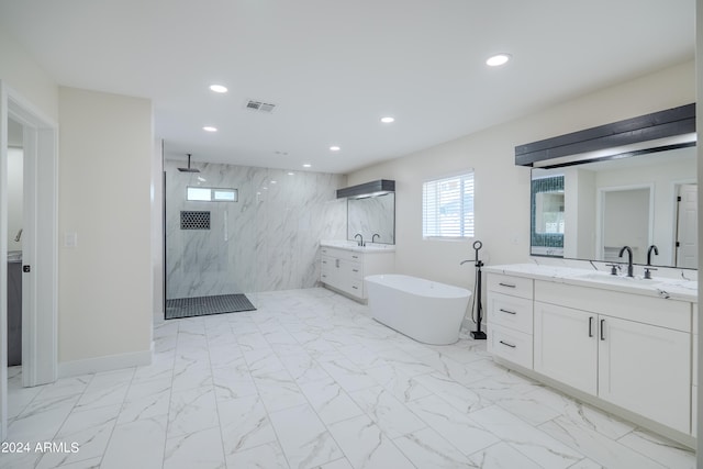 bathroom with shower with separate bathtub and vanity