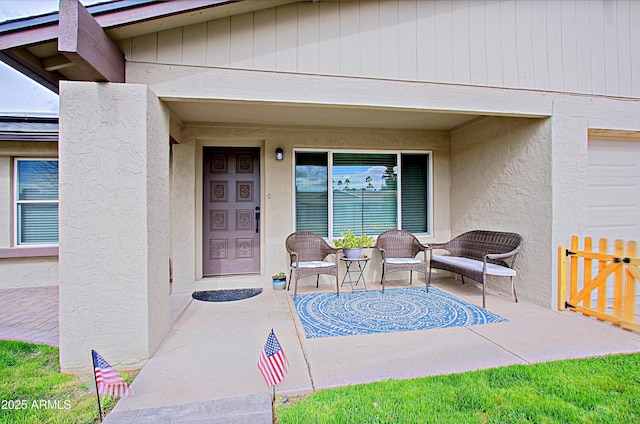 doorway to property with stucco siding