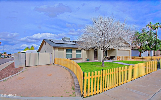 view of front of house featuring a fenced front yard, stucco siding, a front lawn, and a gate