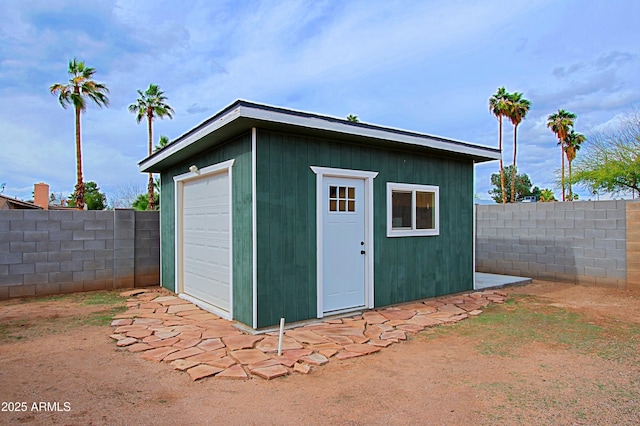 view of outbuilding with an outbuilding and a fenced backyard