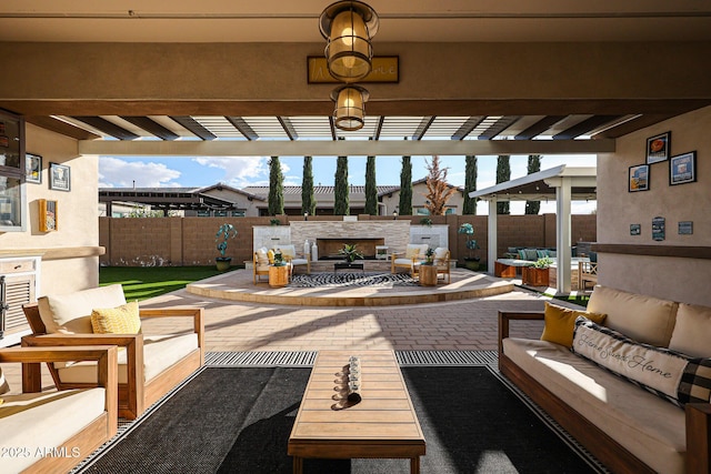 view of patio / terrace with a pergola and an outdoor living space with a fireplace