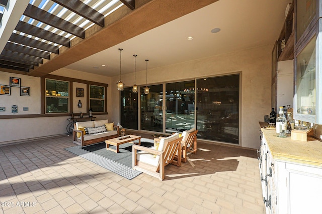 view of patio with an outdoor living space and a pergola