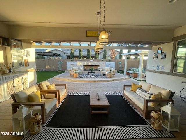 view of patio / terrace with exterior kitchen, an outdoor hangout area, and a pergola