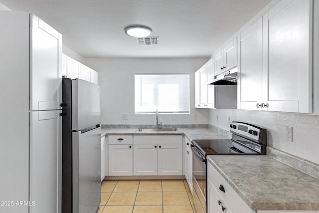 kitchen featuring stainless steel appliances, visible vents, light tile patterned flooring, a sink, and under cabinet range hood