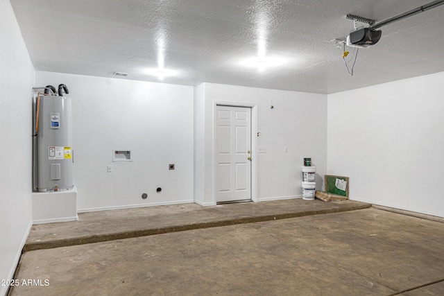 garage with visible vents, baseboards, electric water heater, and a garage door opener