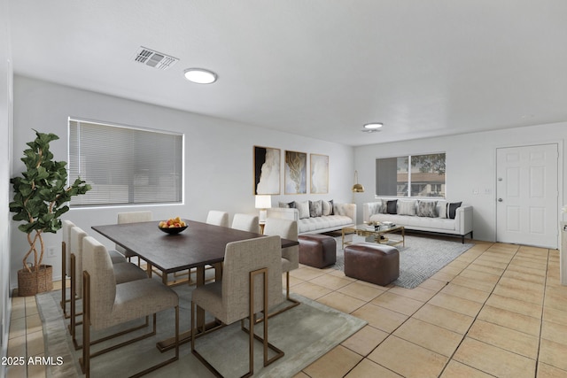 dining space featuring visible vents and light tile patterned flooring