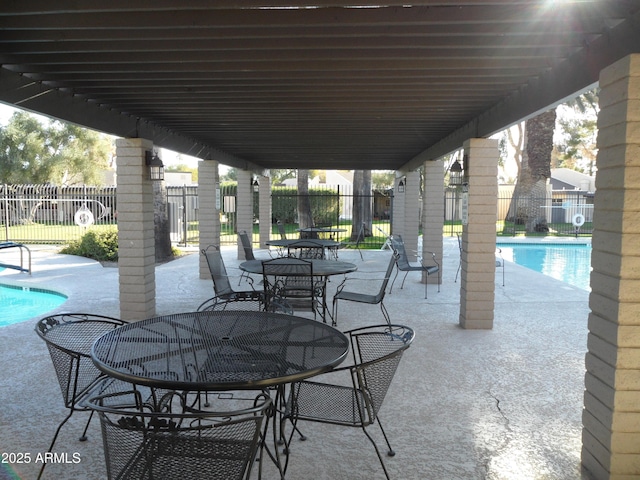 view of patio with a community pool