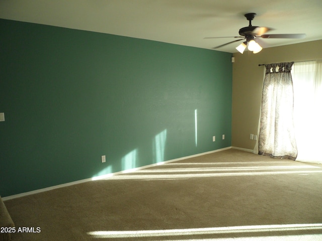 carpeted empty room with ceiling fan