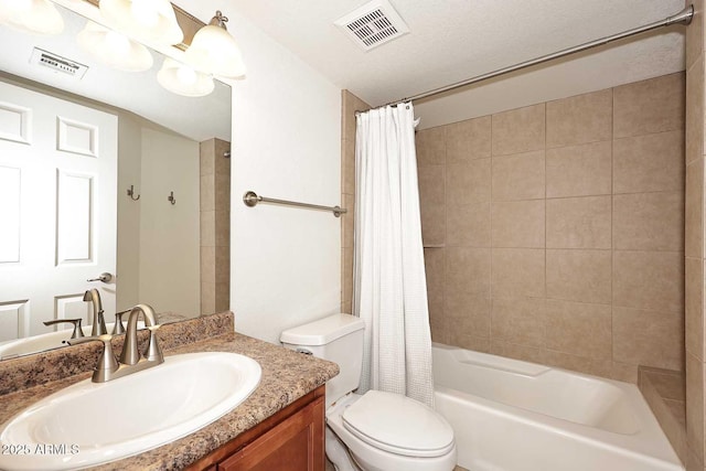 full bathroom featuring shower / tub combo with curtain, vanity, and toilet