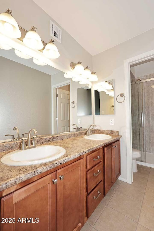 bathroom with walk in shower, tile patterned floors, toilet, and vanity