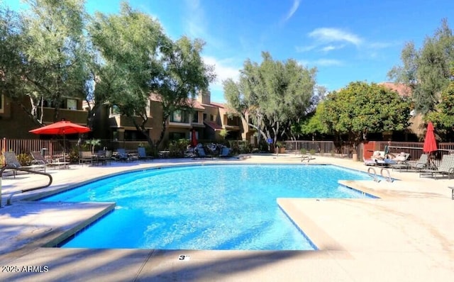 view of swimming pool with a patio area