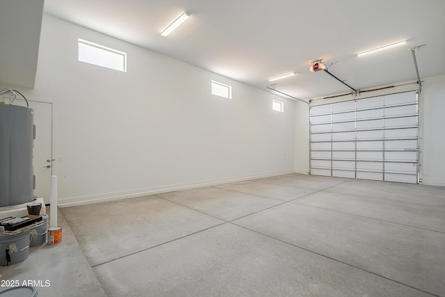 garage with electric water heater and a garage door opener