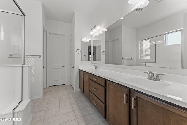 full bath with double vanity, tile patterned flooring, visible vents, and a sink