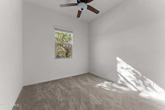 empty room featuring carpet and ceiling fan