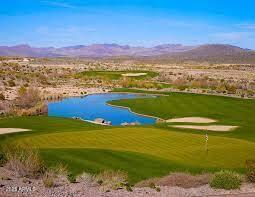 view of home's community with golf course view and a water and mountain view