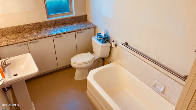 bathroom with a tub, toilet, and concrete floors