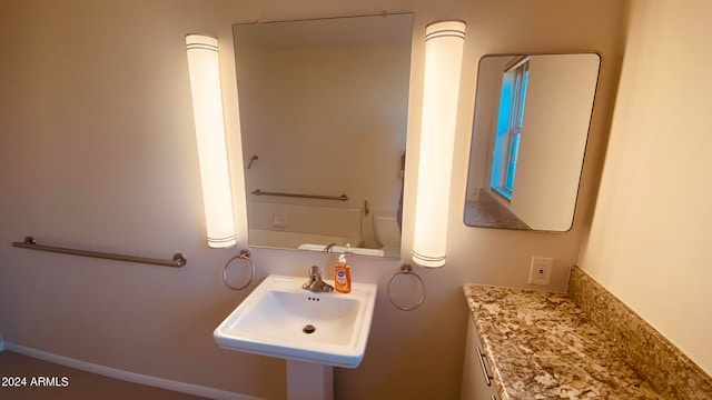 bathroom featuring sink and toilet