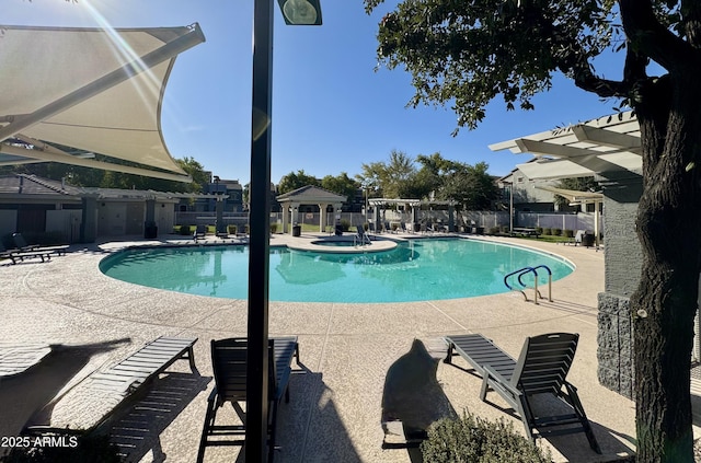 view of swimming pool with a patio