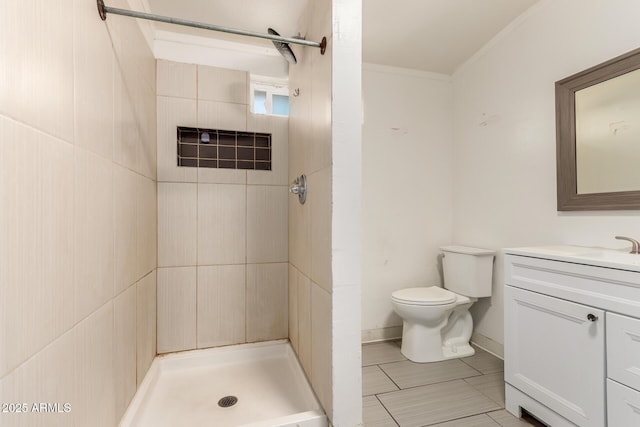 full bath featuring a stall shower, toilet, ornamental molding, tile patterned floors, and vanity