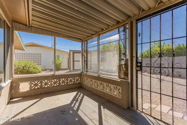 unfurnished sunroom with plenty of natural light