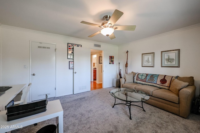 living room featuring ceiling fan, carpet, and crown molding