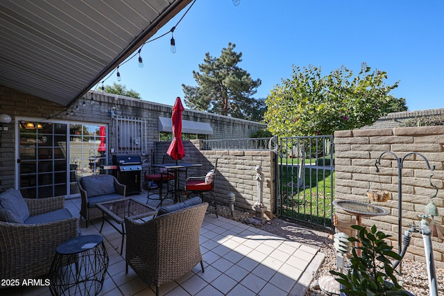 view of patio / terrace with outdoor lounge area and a grill