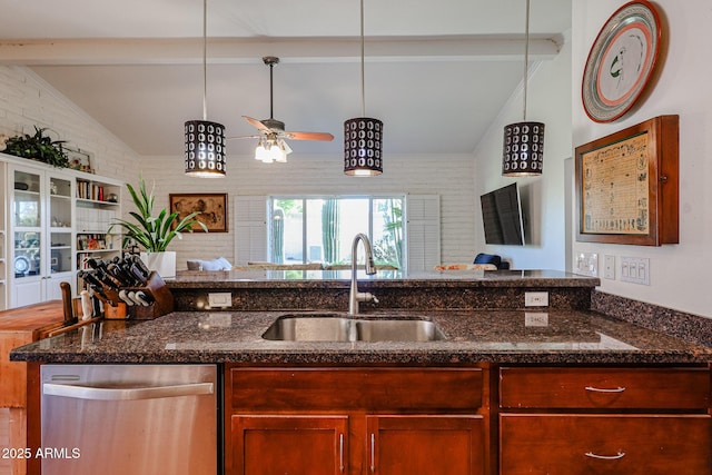 kitchen with sink, dark stone countertops, dishwasher, pendant lighting, and brick wall