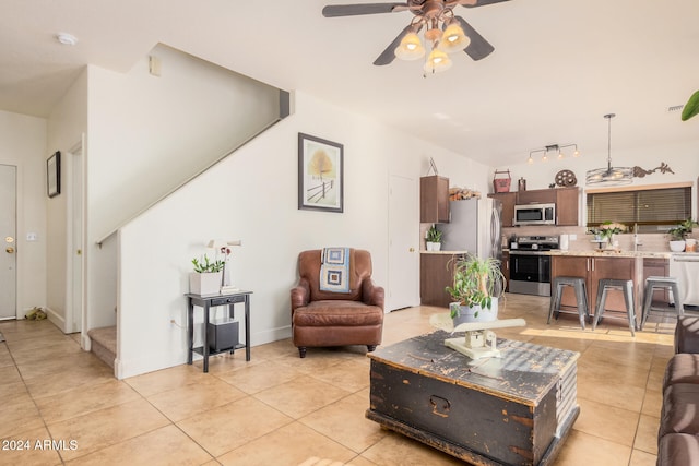 tiled living room featuring ceiling fan