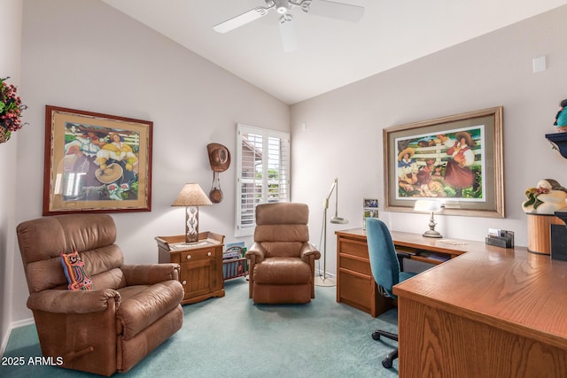 home office with lofted ceiling, ceiling fan, and carpet flooring