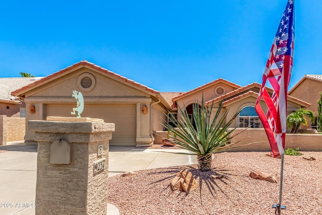 view of front of property with a garage