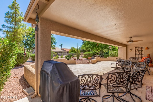 view of patio / terrace with area for grilling and ceiling fan