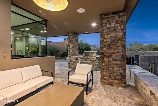 view of patio with an outdoor kitchen, area for grilling, and an outdoor hangout area